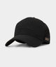 Black Macade Golf Range Snapback featuring a structured brim, sleek tonal embroidery on the front, and subtle