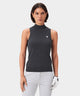 Woman wearing a dark gray Kayla Air Sleeveless Top with a high mock neck, slim fit, and ribbed hem, styled with light gray golf pants and a white golf glove for a modern, refined look on the course.