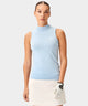 Woman wearing a light blue Kayla Air Sleeveless Top with a high mock neck and ribbed hem, paired with a cream golf skirt and glove, showcasing the top’s soft knit texture, minimal branding, and modern fit for a polished spring golf outfit.