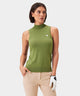 Woman wearing a sheen green Kayla Air Sleeveless Top with a high mock neck, slim fit, and subtle chest logo, paired with tan golf pants and a white golf glove for a fresh, modern golf ensemble.