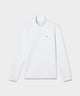 Man wearing the Macade Golf Therma Quarter Zip in white, styled with black pants, a light gray cap, and a golf glove, showcasing the sweater’s minimalist design, subtle chest logo, and modern athletic fit for versatile golf and everyday wear.