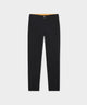Macade Golf Lightweight Trouser in black laid flat, featuring a slim, modern cut with front pockets and a hint of the signature silicone gel waistband lining visible at the top.