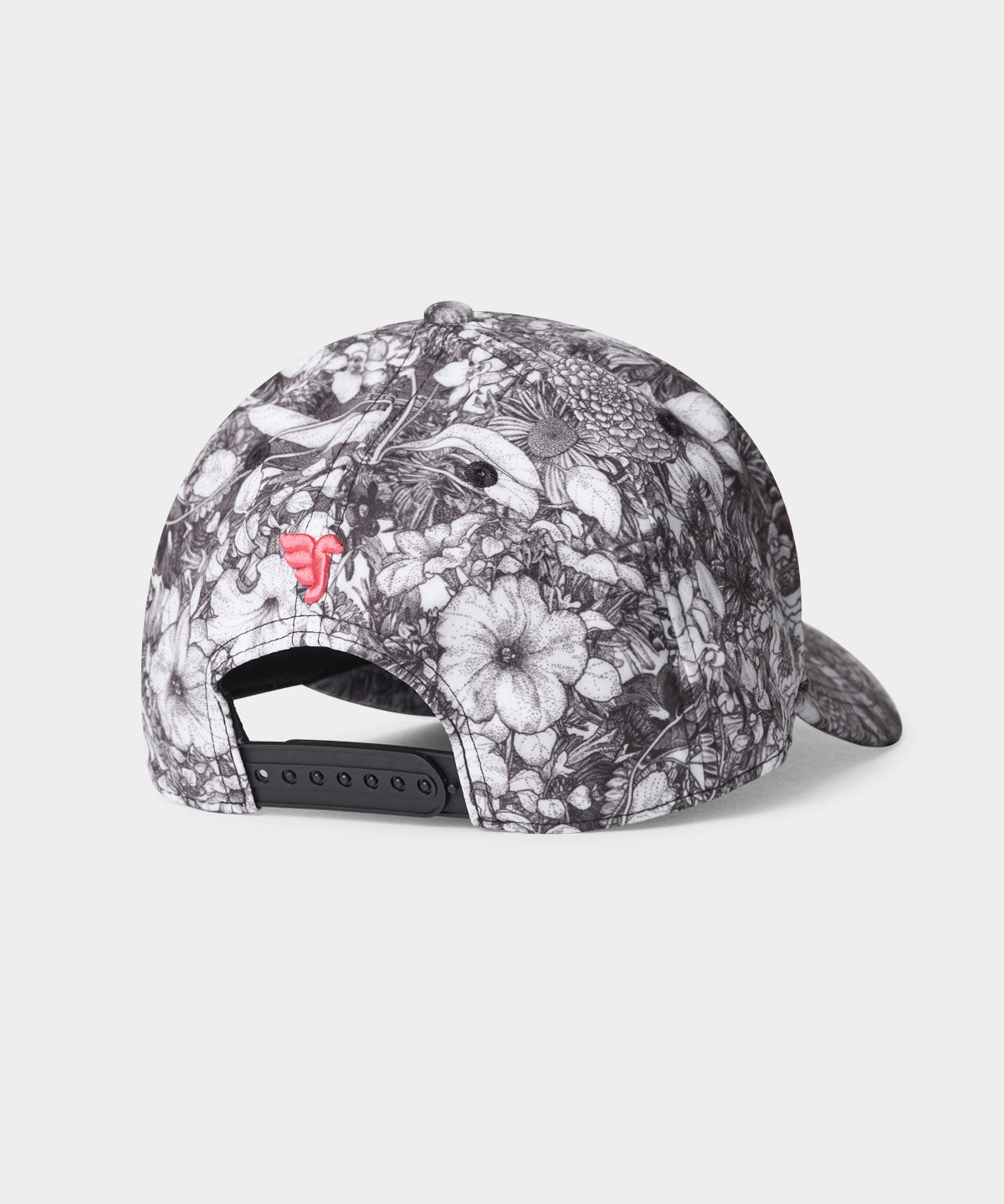 Back view of the Range Snapback by Macade Golf in a black and white floral print, featuring a pink embroidered logo and an adjustable snap closure for a custom fit.