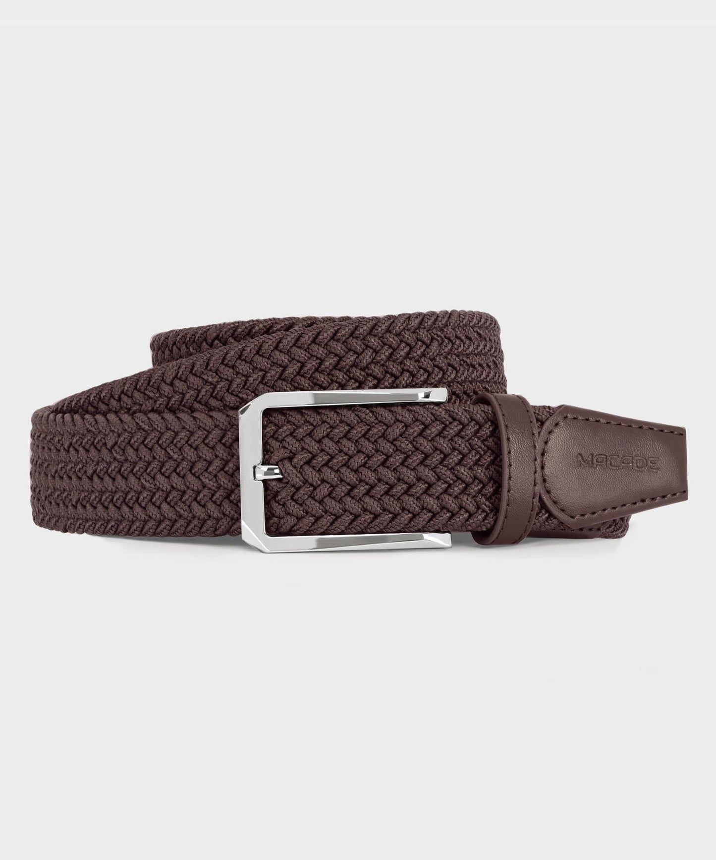 Macade Golf Elastic Belt in tan with braided stretch polyester, a polished stainless steel buckle, and minimal embossed leather tip for a refined, versatile look.