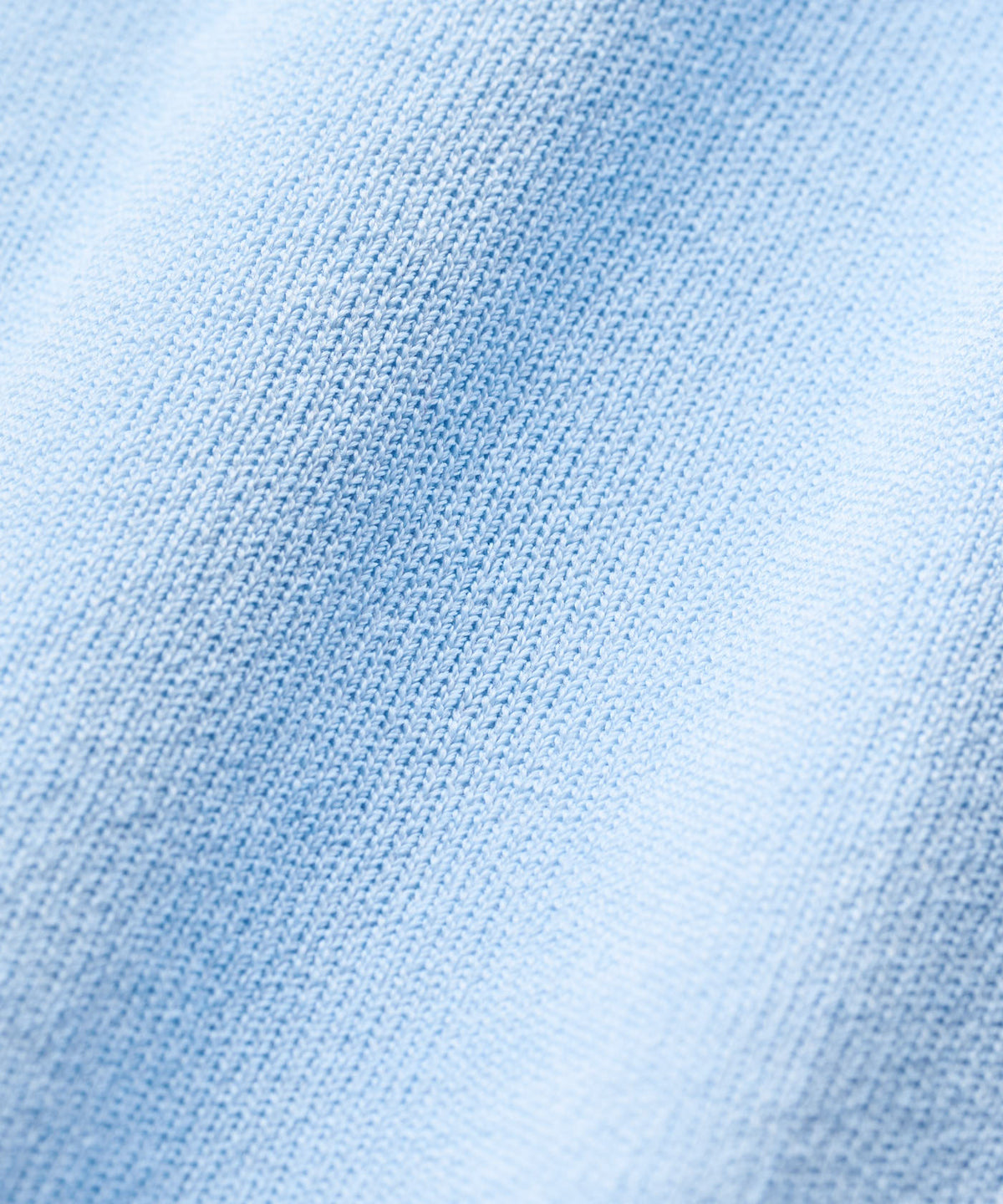 Close-up of the light blue Kayla Air Sleeveless Top fabric, highlighting its fine, breathable knit texture and soft, lightweight construction.
