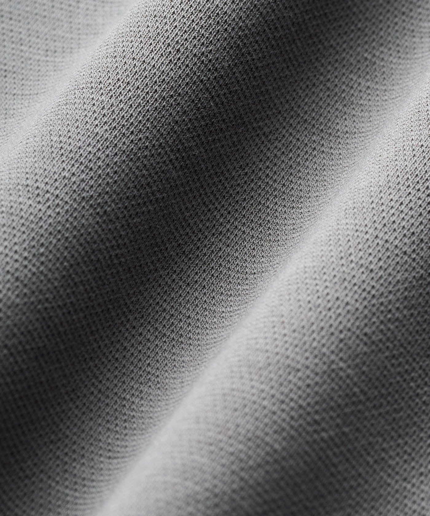 Close-up of the Rae Polo Sweatshirt fabric in Teal Gray, highlighting the heavyweight jersey knit texture with a smooth, structured surface and premium blend of polyester, cotton, and spandex.