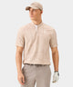 Man wearing the Macade Golf Heath Bomber Shirt in tan with a subtle palm print, featuring a bomber-style collar, minimal white branding, and short sleeves, paired with taupe golf trousers, a matching cap, and a golf glove for a refined, modern golf look.
