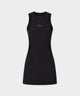 Model wearing the Macade Golf Inez Sleeveless Dress in solid black, featuring a fitted, above-the-knee silhouette with minimal branding and a modern, athletic style, paired with a white golf glove.