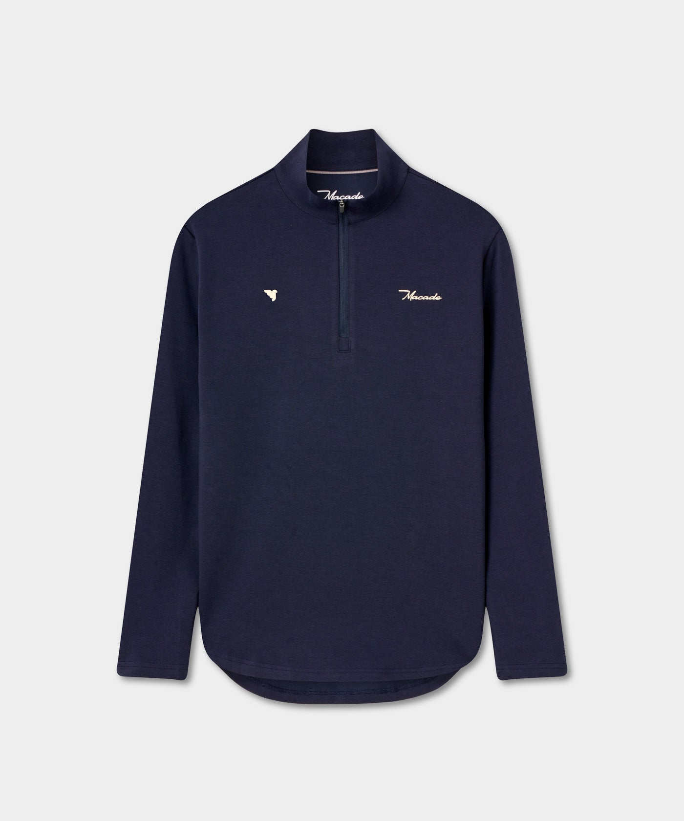 Zoe Flex Quarter Zip women’s golf sweater in blue, featuring a high collar, smooth quarter zip, extended tail hem, and understated Macade branding for a refined, modern look.